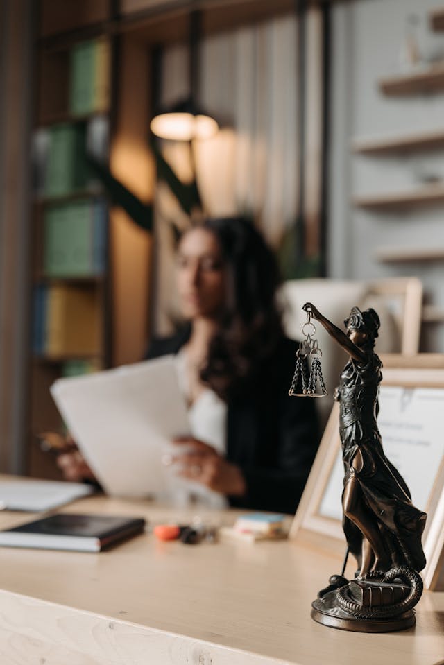 figurine-of-justice-on-table-in-office